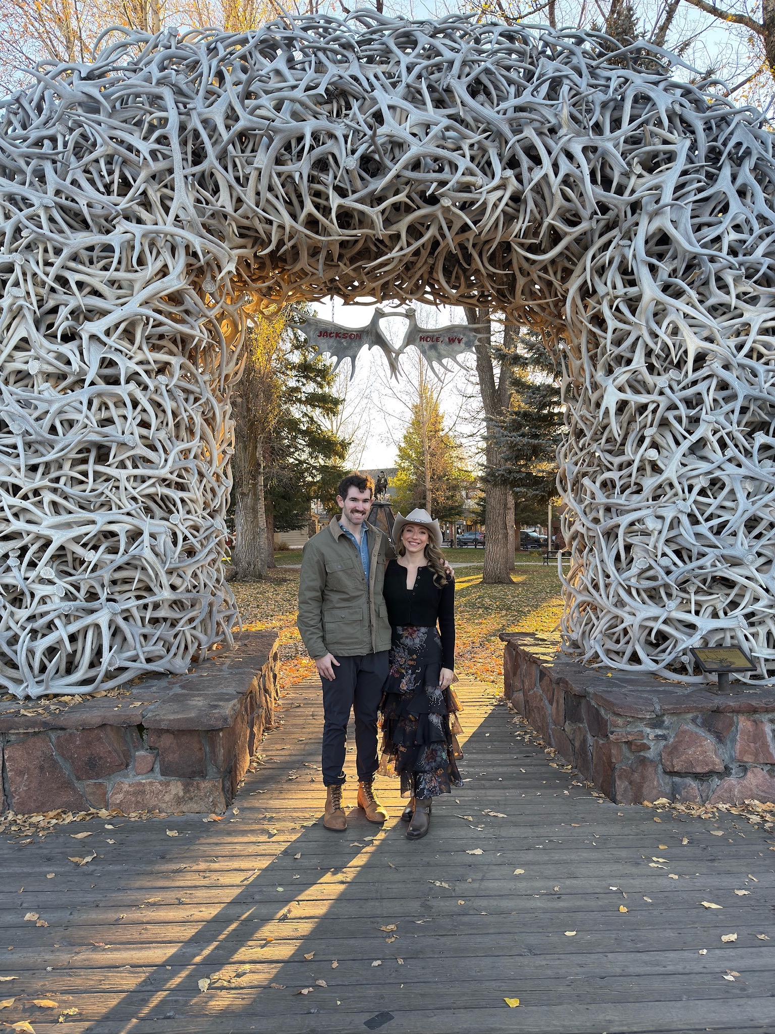 Arianna and Aaron in front of the antler arches